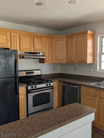 a kitchen with a stove and a sink