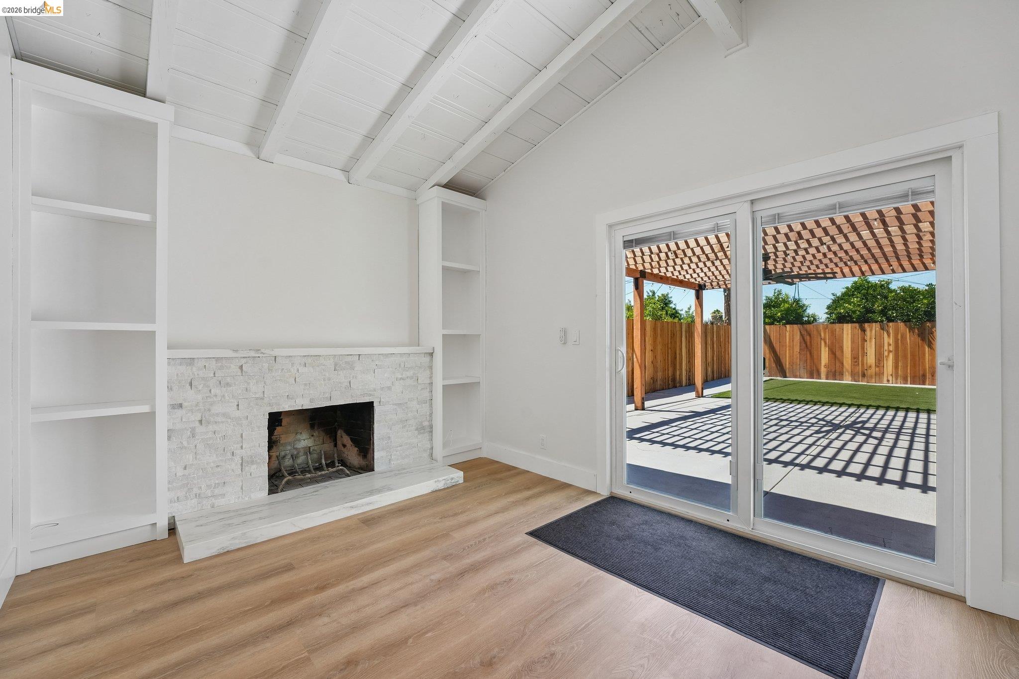 375 Senter Road San Jose, CA 95111 - Photo 22 of 80 a view of an empty room with wooden floor fireplace and a window