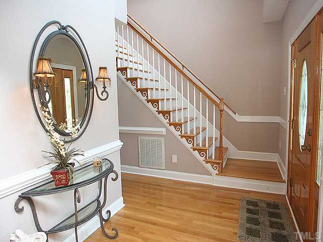 1704 Pagan Road Raleigh, NC 27603 - Photo 3 of 12 a view of a livingroom with furniture entryway wooden floor and a mirror
