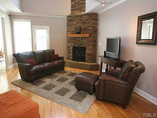 1704 Pagan Road Raleigh, NC 27603 - Photo 4 of 12 a living room with furniture and a fireplace