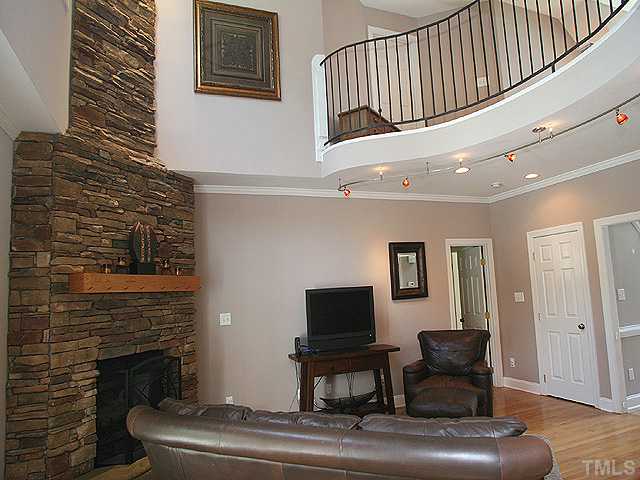 1704 Pagan Road Raleigh, NC 27603 - Photo 5 of 12 a living room with furniture and a fireplace
