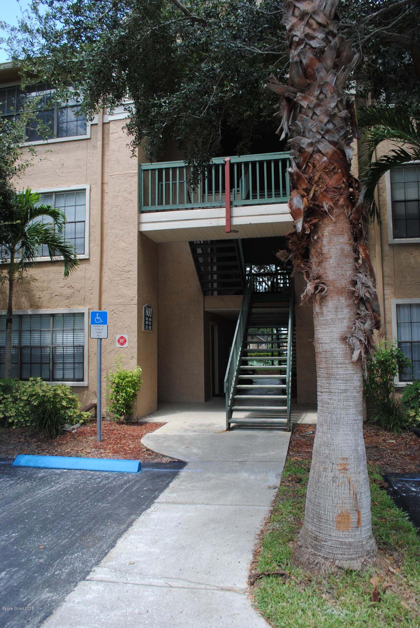 7667 North Wickham Road, Unit 812 Melbourne, FL 32940 - Photo 1 of 17 a front view of a house with a yard