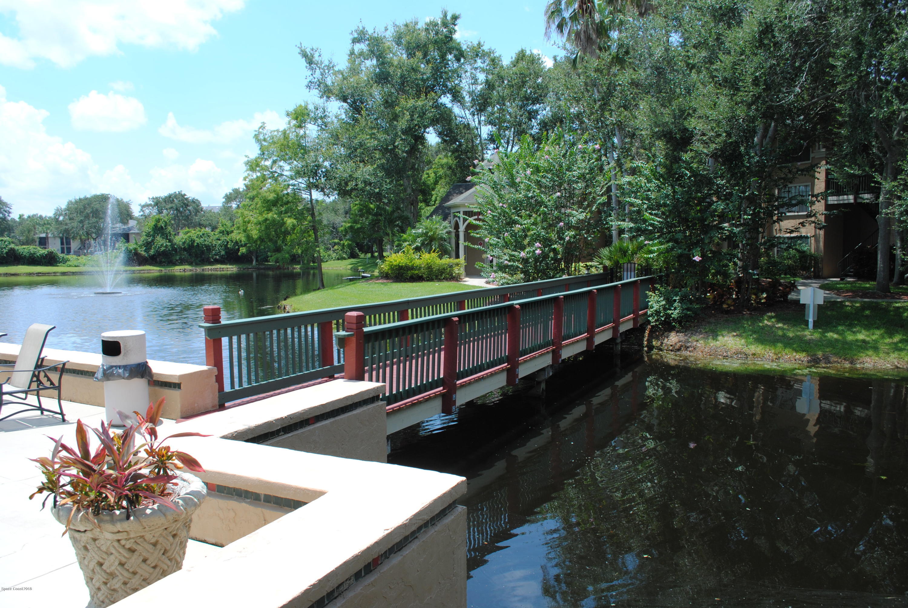 7667 North Wickham Road, Unit 812 Melbourne, FL 32940 - Photo 12 of 17 a view of a lake from a balcony