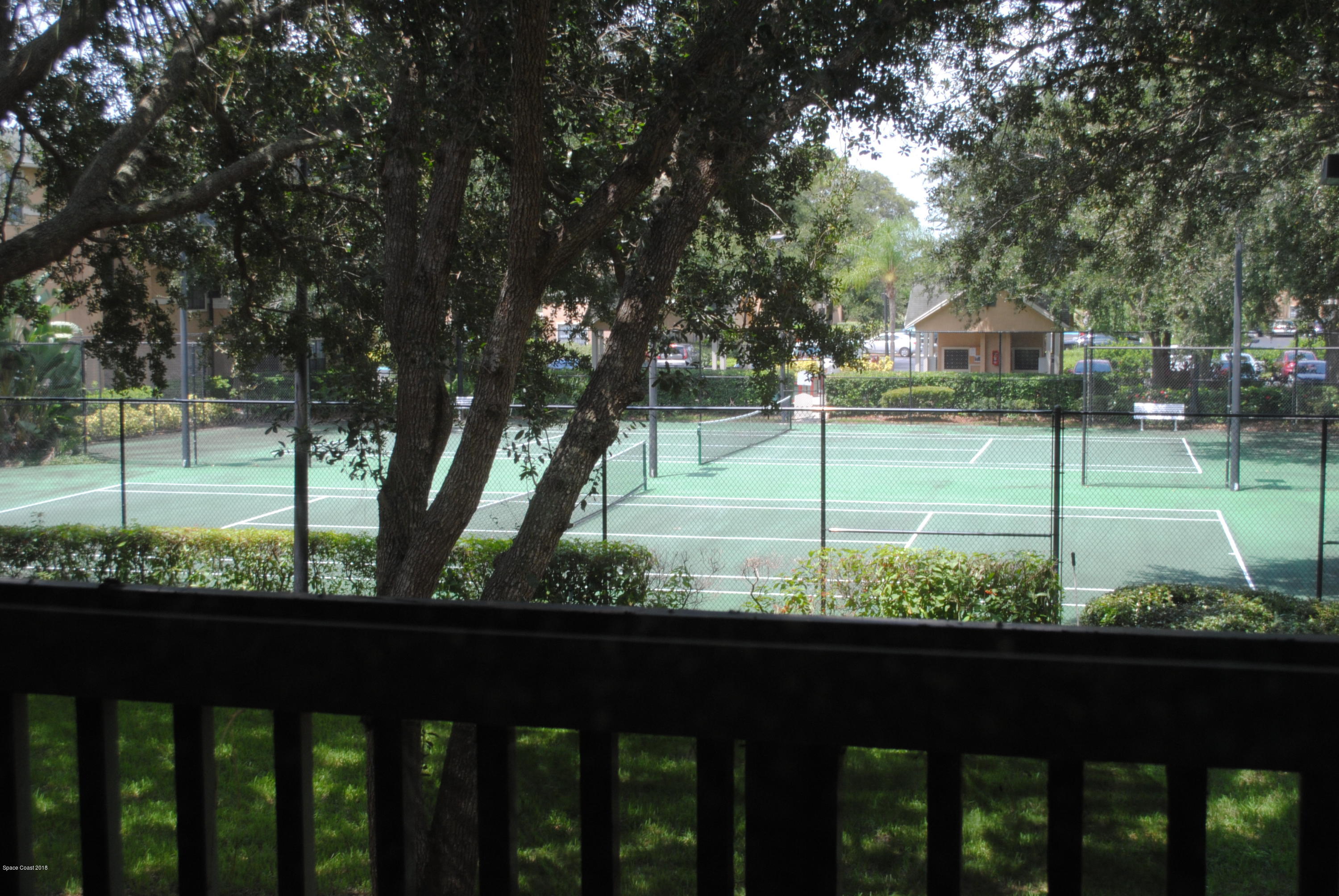 7667 North Wickham Road, Unit 812 Melbourne, FL 32940 - Photo 15 of 17 a view of a wooden fence