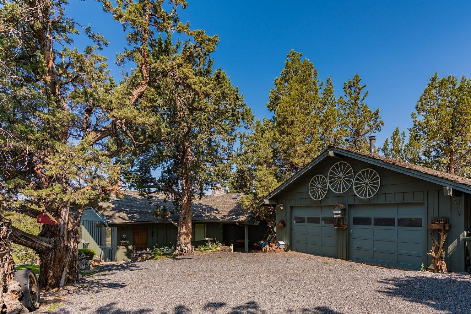 65035 Hopper Road Bend, OR 97703 - Photo 3 of 21 a front view of a house with a yard
