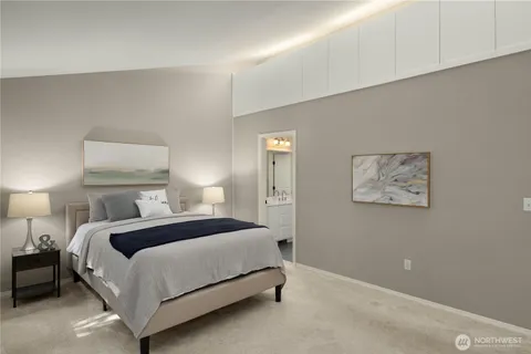 a bedroom with a bed and a lamp