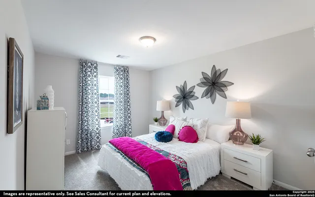 a bedroom with a bed and a potted plant