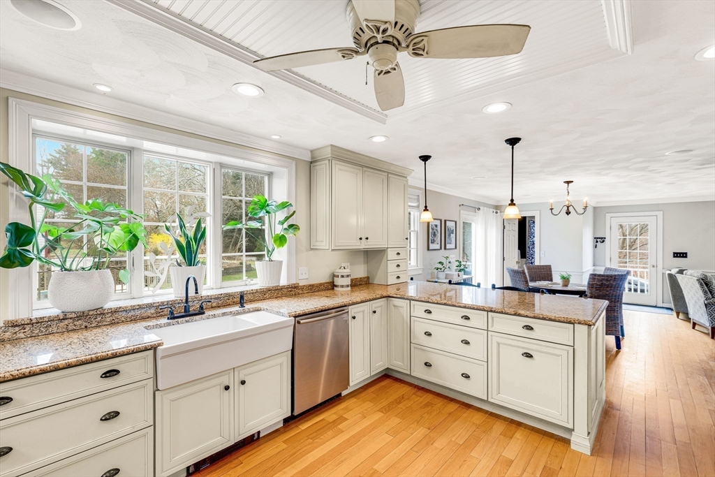 54 Old Merrill Street Amesbury, MA 01913 - Photo 12 of 34 a kitchen with counter top space and wooden floor