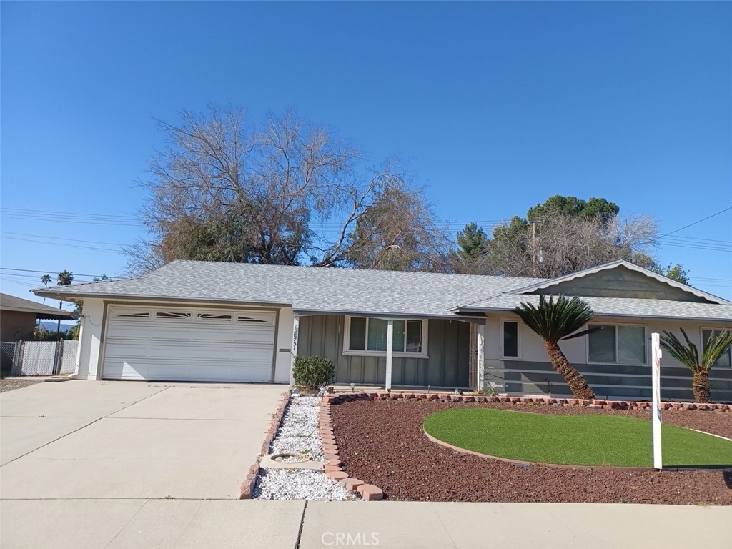 28751 Bradley Road Menifee, CA 92586 - Photo 2 of 19 a front view of a house with a garden