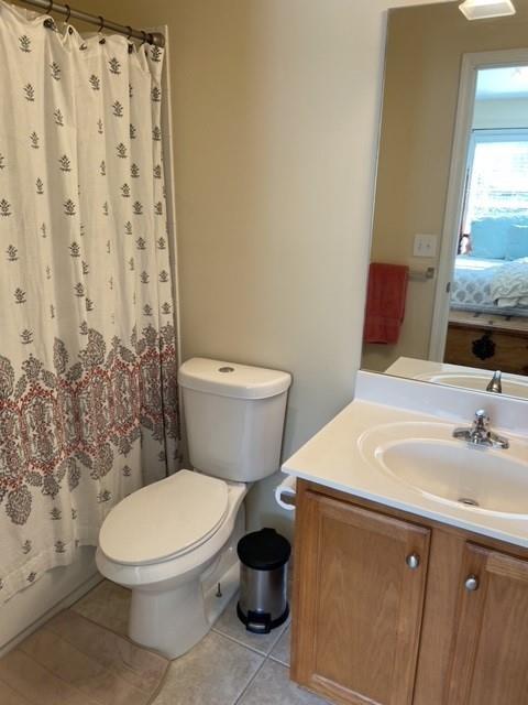 232 Epps Bridge Road, Unit 1A Athens, GA 30606 - Photo 7 of 14 a white toilet sitting next to a bathroom sink