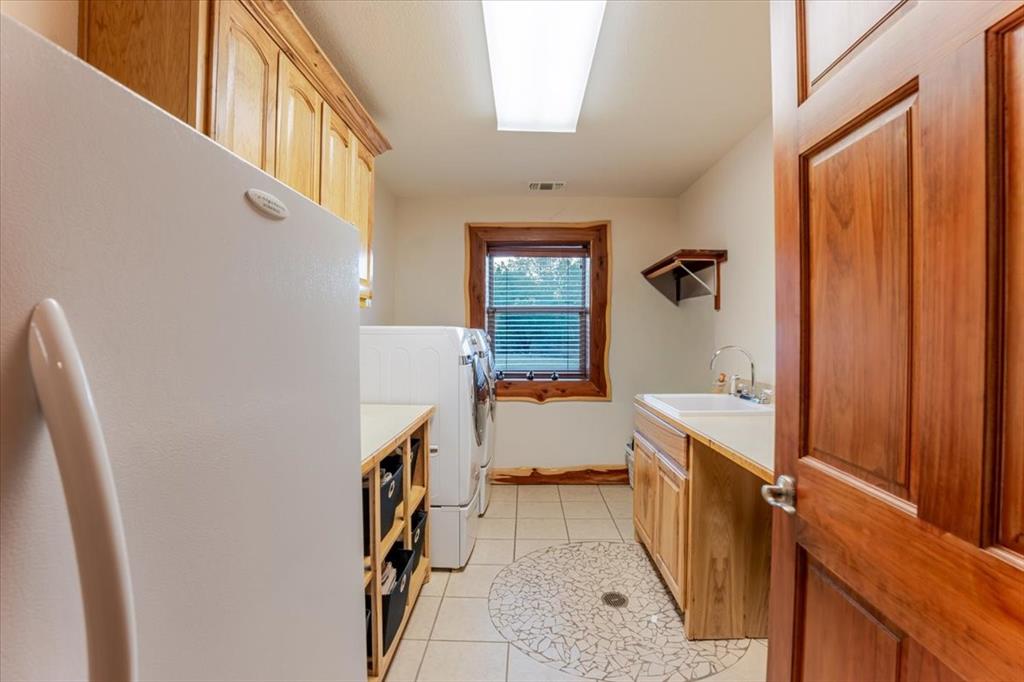 2117 Highway 6 Cisco, TX 76437 - Photo 19 of 35 a room with a washer and dryer