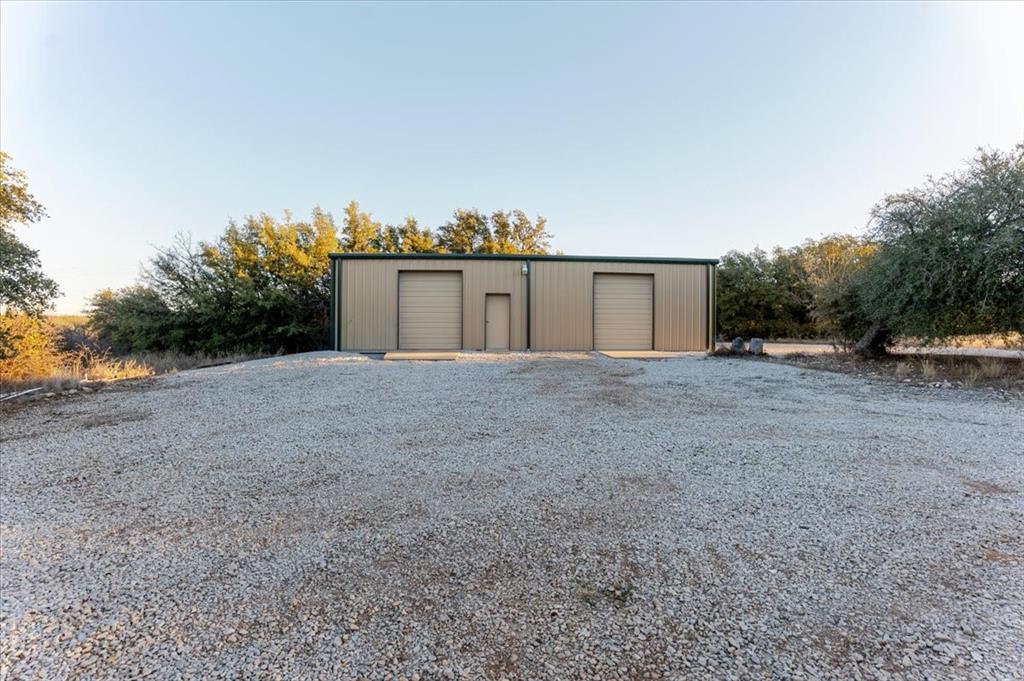 2117 Highway 6 Cisco, TX 76437 - Photo 25 of 35 a view of a dry yard with a tree