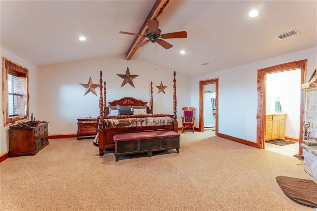 2117 Highway 6 Cisco, TX 76437 - Photo 5 of 35 a bedroom with furniture and a chandelier