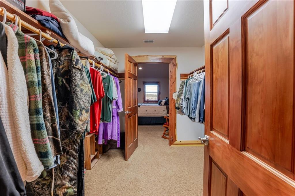 2117 Highway 6 Cisco, TX 76437 - Photo 7 of 35 a view of walk in closet with clothes