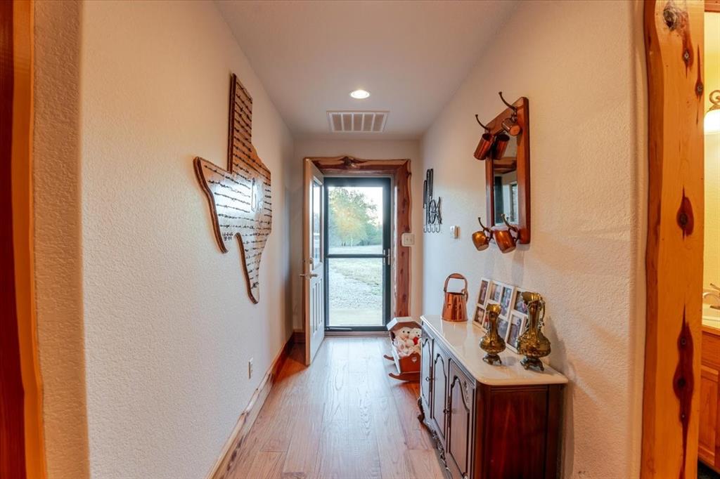 2117 Highway 6 Cisco, TX 76437 - Photo 8 of 35 a view of a hallway with a white walls and a window