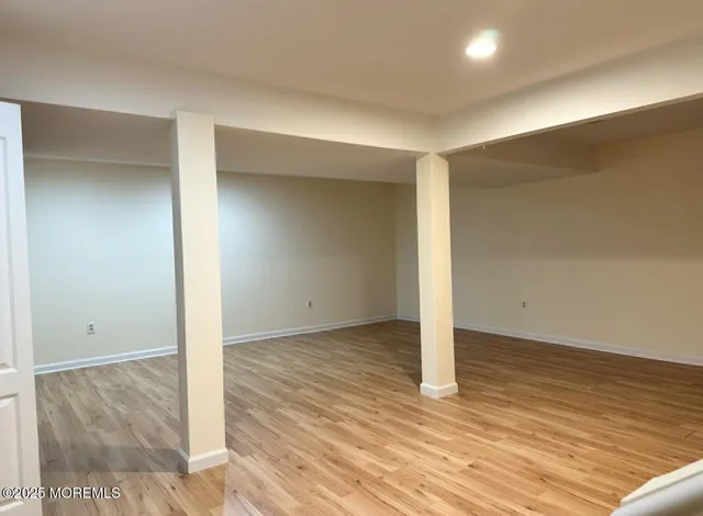 an empty room with wooden floor