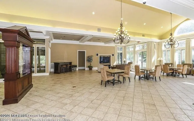 a lobby with furniture and a chandelier