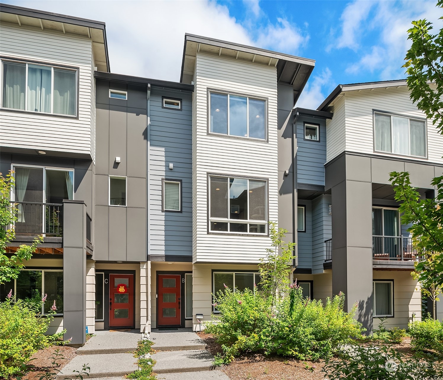 616 237th Place Southeast, Unit B Bothell, WA 98021 - Photo 1 of 33 a front view of a multi story residential apartment building