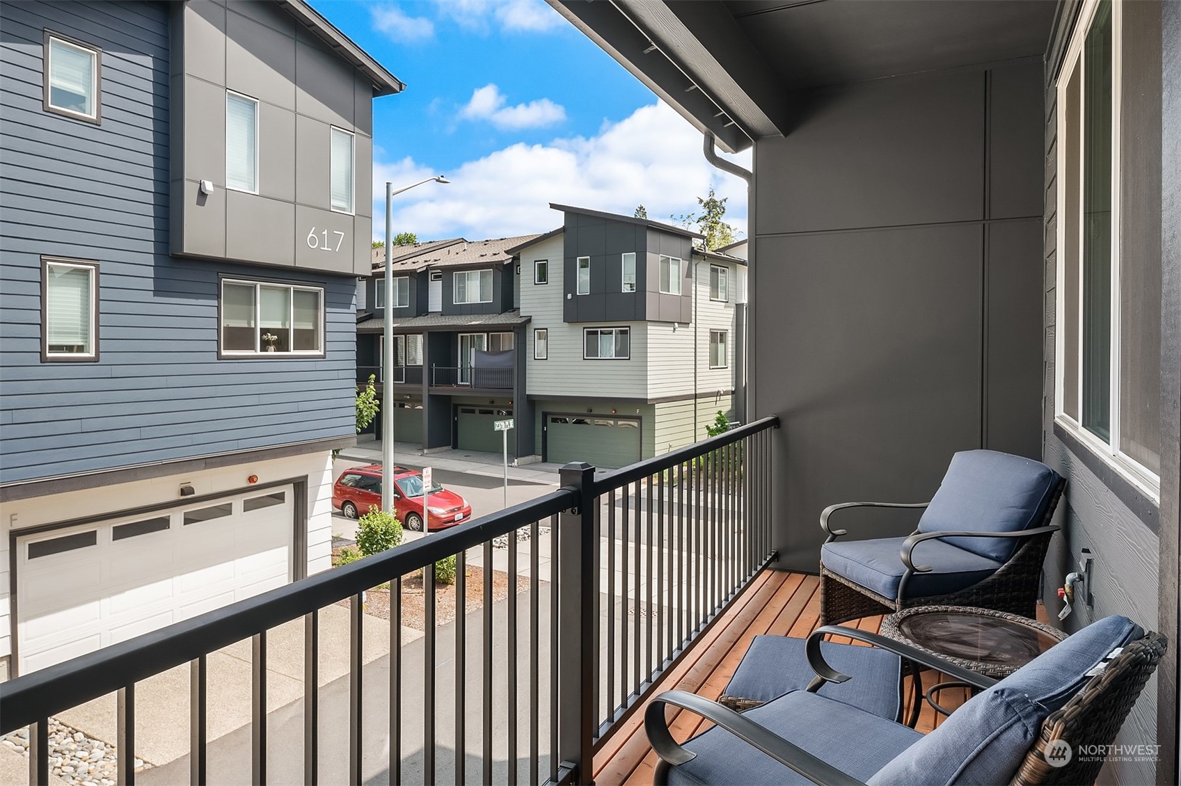 616 237th Place Southeast, Unit B Bothell, WA 98021 - Photo 18 of 33 a balcony view with couple of chairs and a barbeque