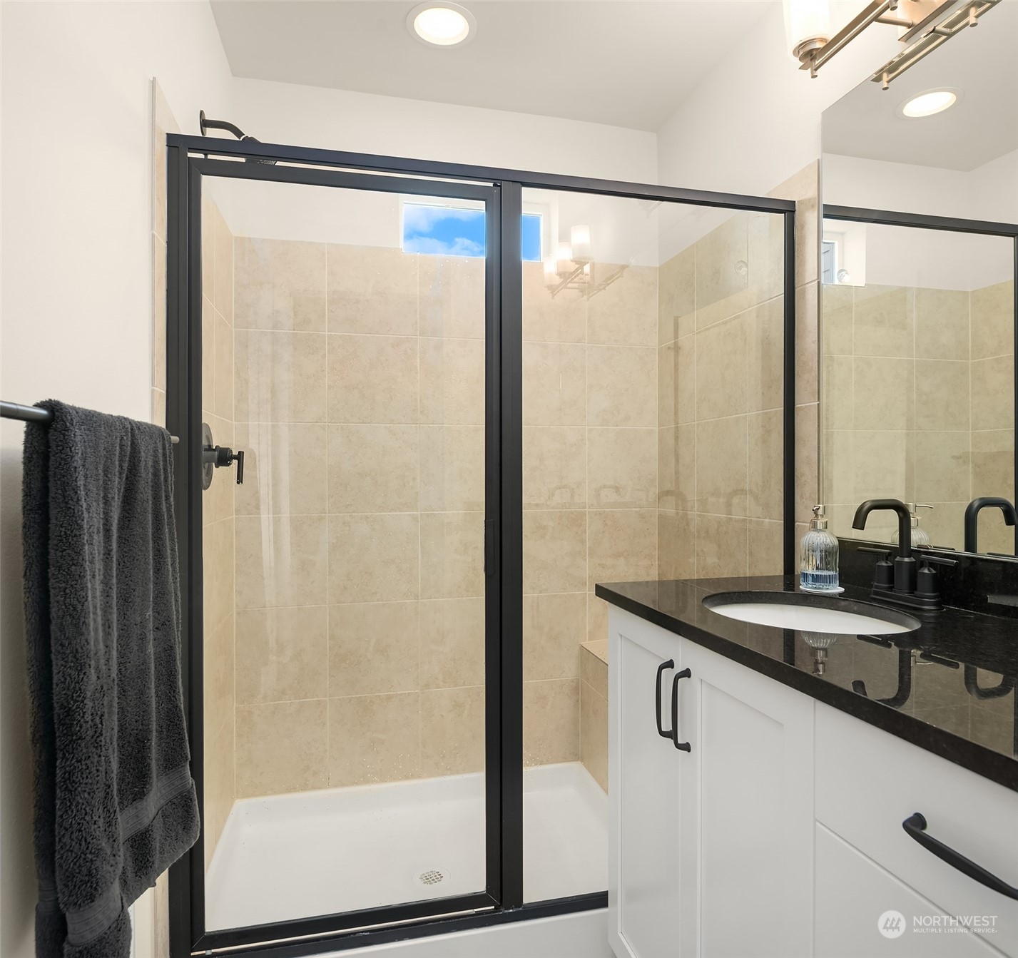 616 237th Place Southeast, Unit B Bothell, WA 98021 - Photo 21 of 33 a bathroom with a granite countertop sink and a mirror