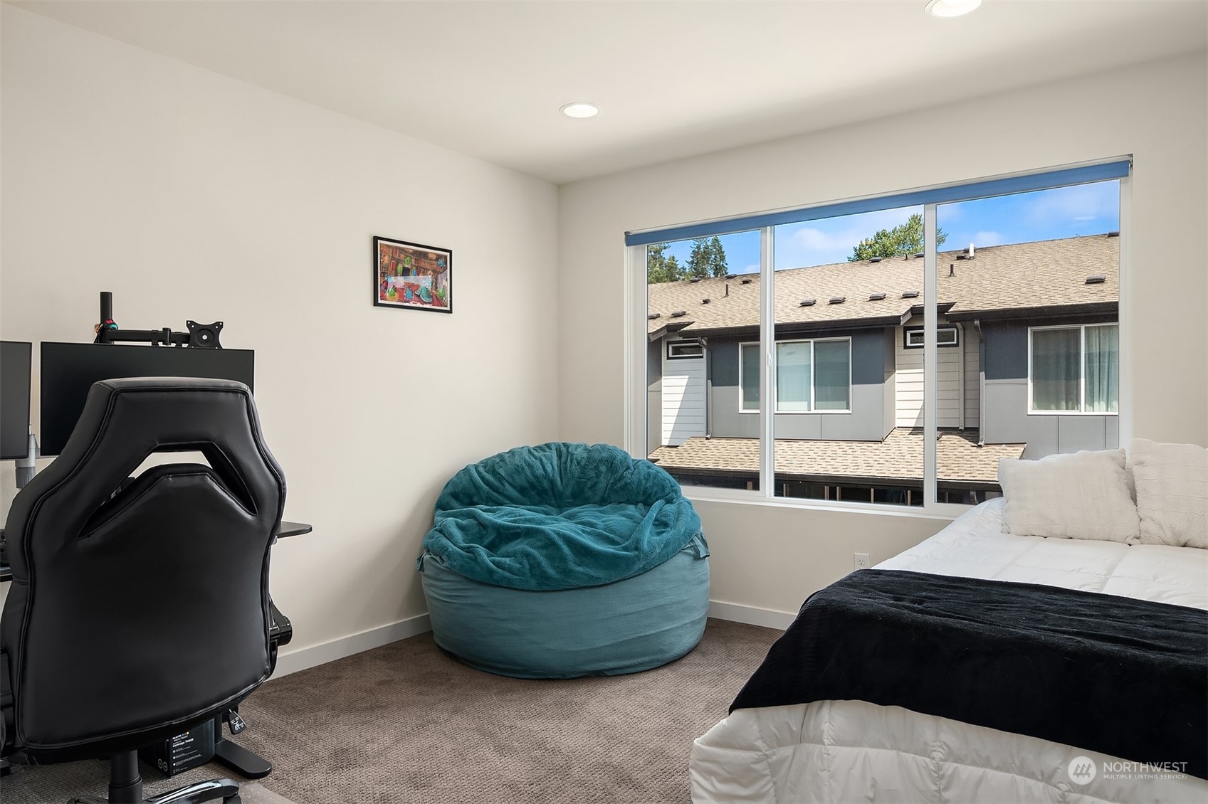 616 237th Place Southeast, Unit B Bothell, WA 98021 - Photo 24 of 33 a room with furniture and a chair