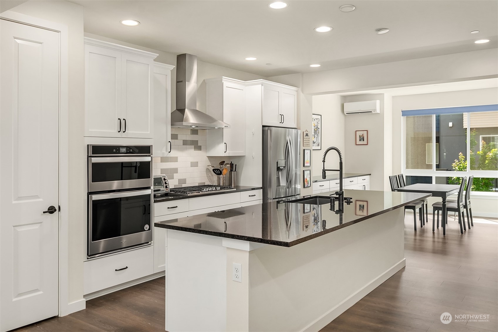 616 237th Place Southeast, Unit B Bothell, WA 98021 - Photo 4 of 33 a kitchen with stainless steel appliances a refrigerator a stove top oven and sink