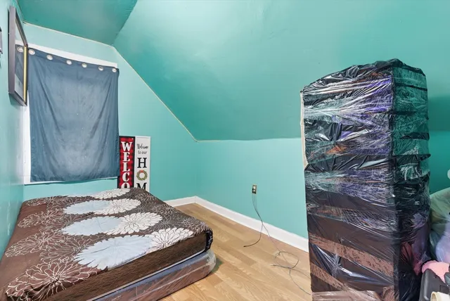 a bedroom with a bed and a dresser