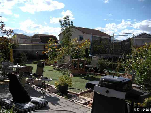8931 Grisom Way Reno, NV 89506 - Photo 13 of 13 a backyard of a house with lots of green space