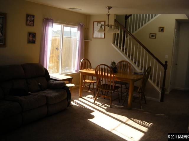 8931 Grisom Way Reno, NV 89506 - Photo 2 of 13 a living room with furniture and a window