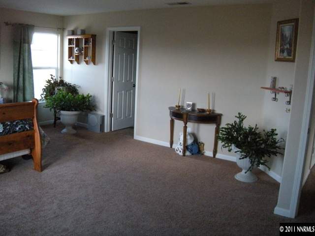 8931 Grisom Way Reno, NV 89506 - Photo 7 of 13 a view of a livingroom with furniture and a potted plant