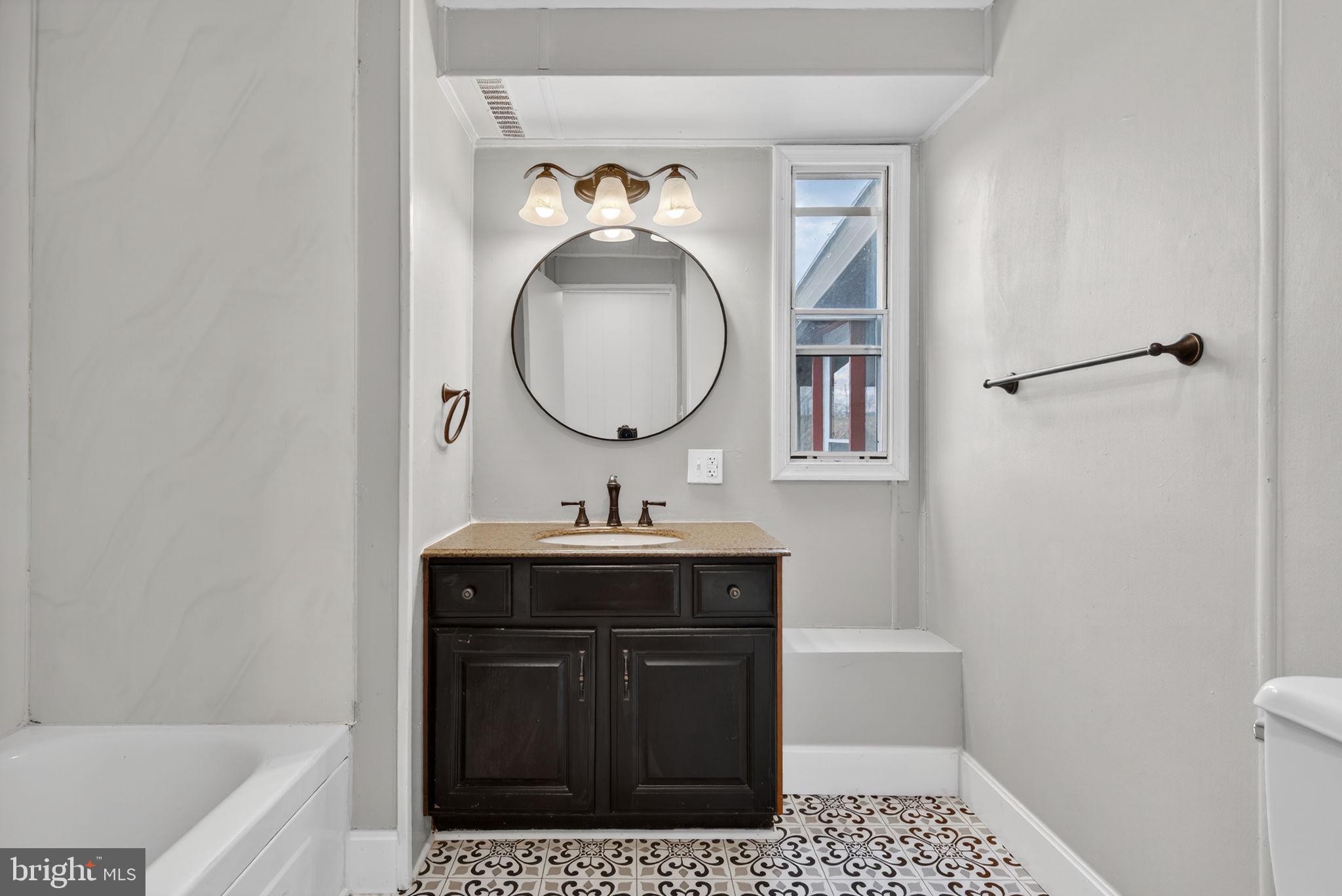 4918 Pleasant Valley Road York, PA 17406 - Photo 24 of 30 a bathroom with a sink a vanity and a mirror