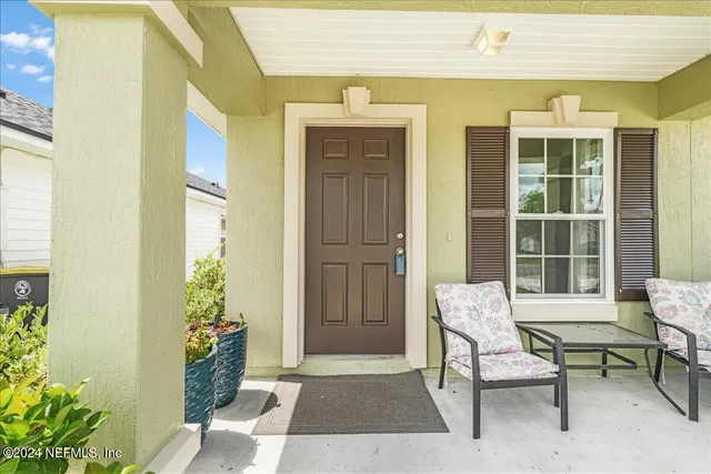 a living room with furniture or couch and a wooden floor