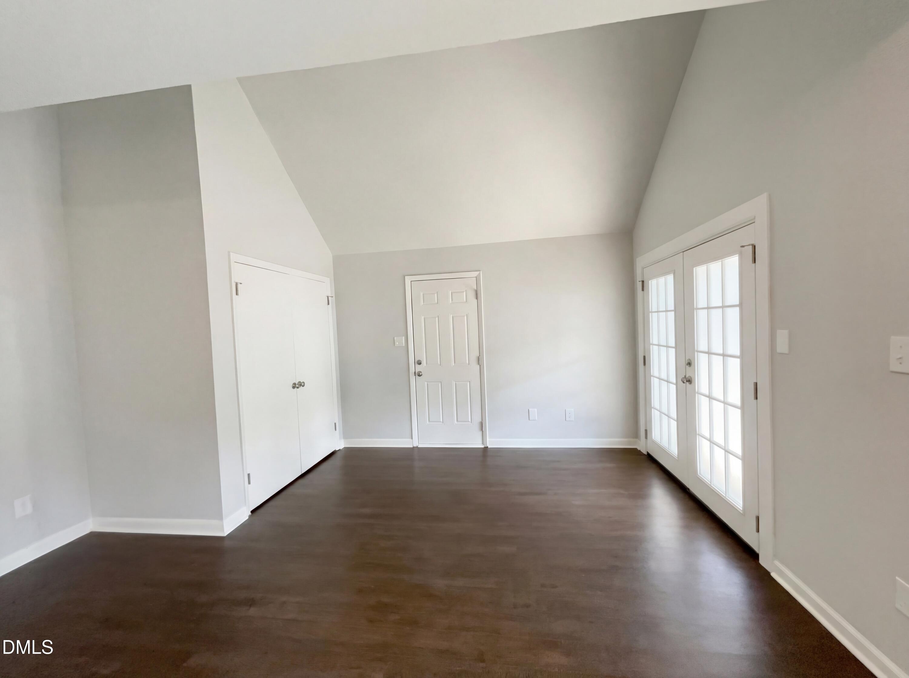 4113 Mill Bridge Road Hope Mills, NC 28348 - Photo 12 of 18 an empty room with wooden floor and windows