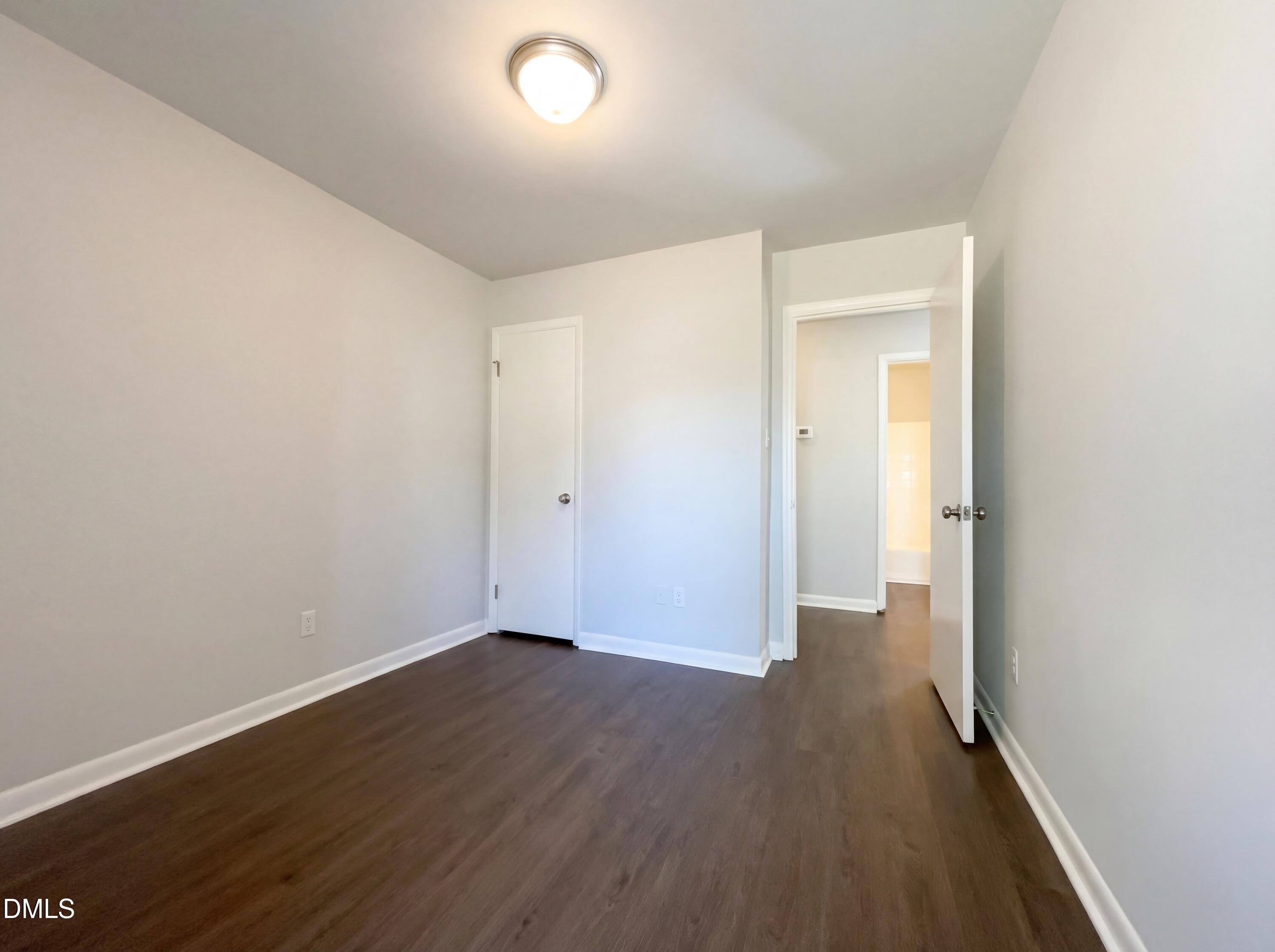 4113 Mill Bridge Road Hope Mills, NC 28348 - Photo 14 of 18 wooden floor in an empty room