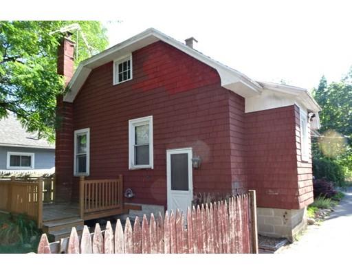 126 Jasper Street Springfield, MA 01109 - Photo 2 of 14 a view of a brick house with a small yard and plants