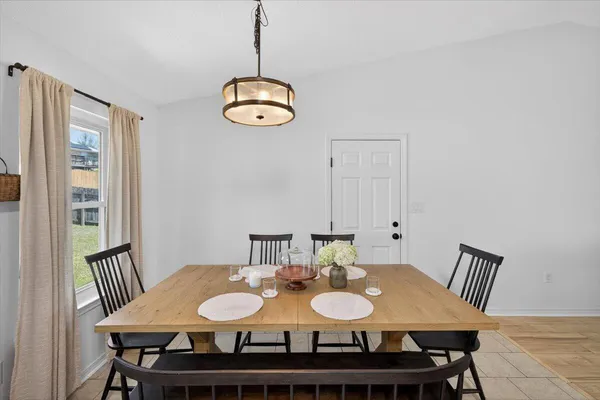 a kitchen with stainless steel appliances granite countertop a sink a counter space and cabinets