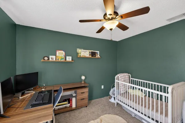 a workspace with furniture and a window