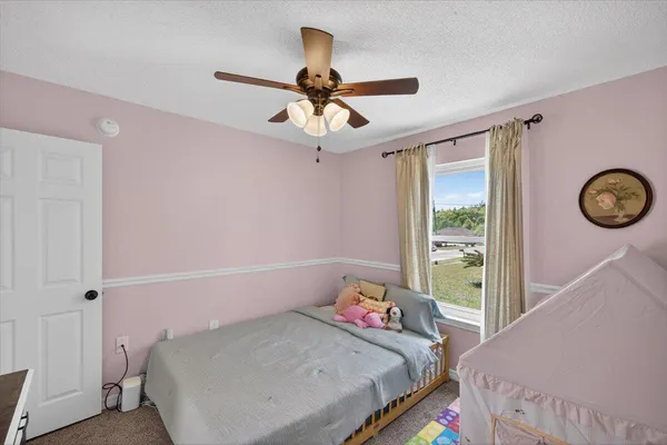 a bathroom with a sink mirror and toilet