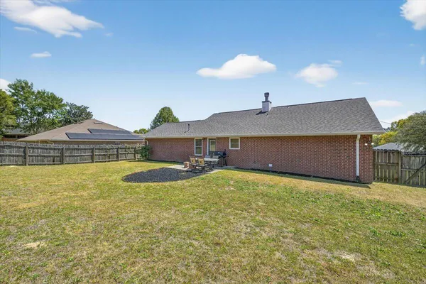 a house view with seating space and yard