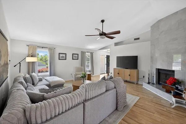 a living room with furniture and a flat screen tv