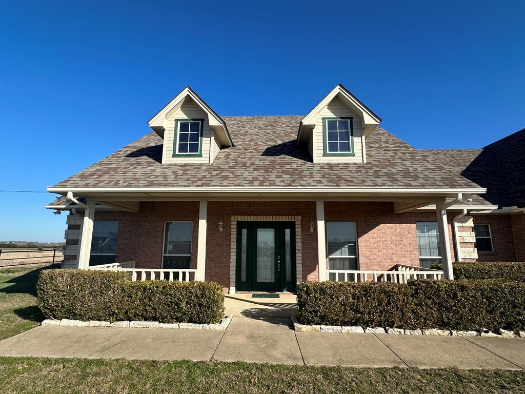 8324-c R 1006 C R 1006 Godley, TX 76044 - Photo 2 of 23 a front view of house with garage and yard