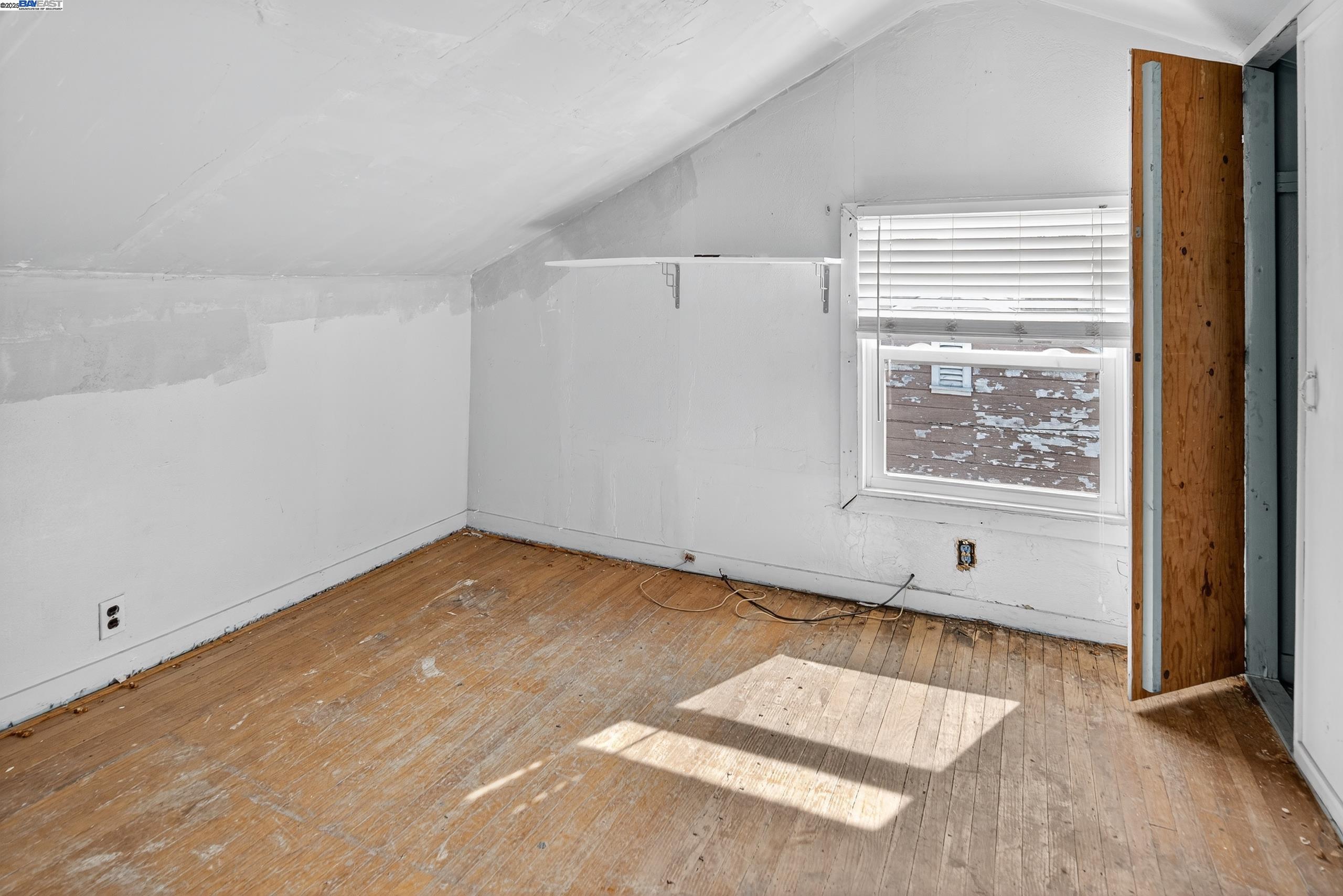 7412 Weld Street Oakland, CA 94621 - Photo 16 of 19 a view of an empty room and window