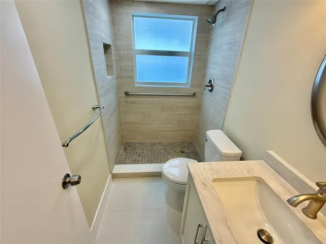 a bathroom with a sink and toilet