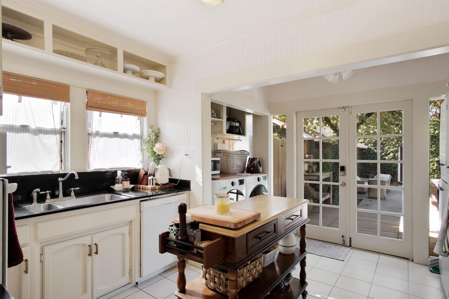 525 Semple Street Modesto, CA 95354 - Photo 11 of 38 a living room with furniture a large window and potted plants