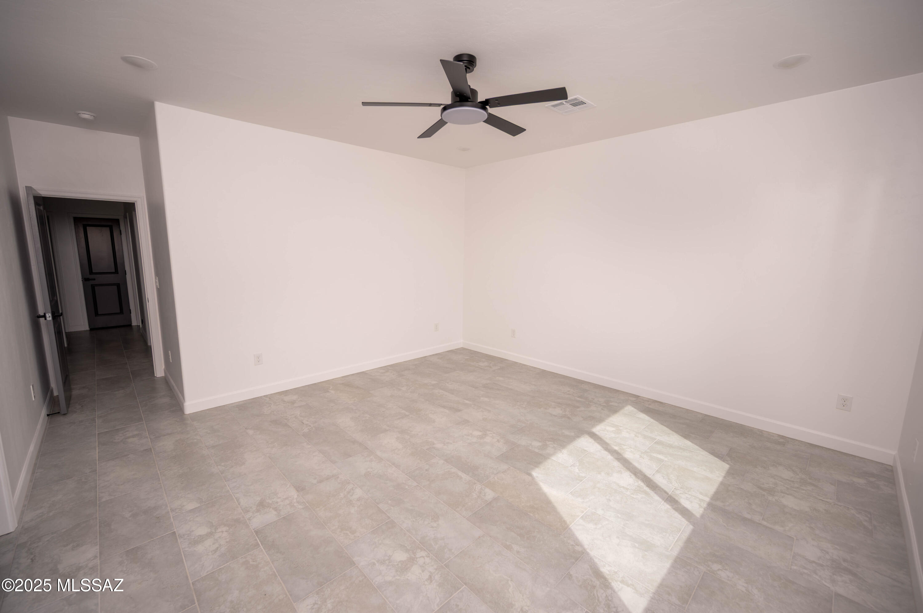 1781 Elder Court Rio Rico, AZ 85648 - Photo 18 of 50 a view of a room with a ceiling fan
