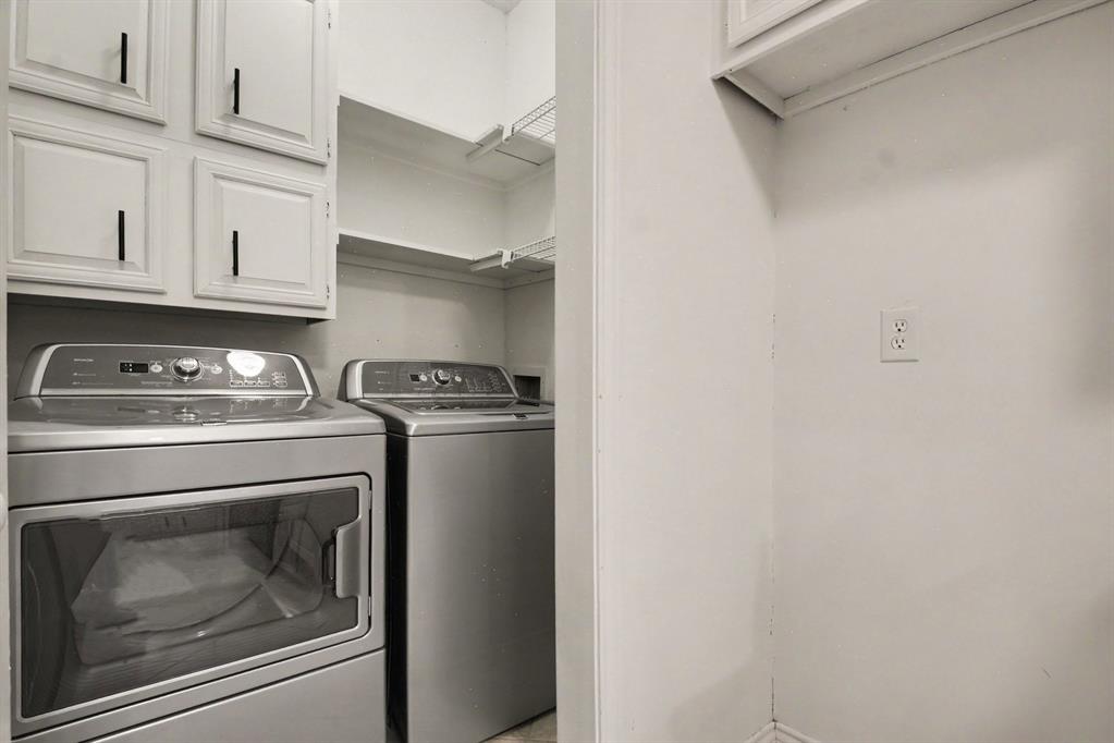14277 Preston Road, Unit 315 Dallas, TX 75254 - Photo 17 of 20 Laundry area with washer/dryer space and extra storage.