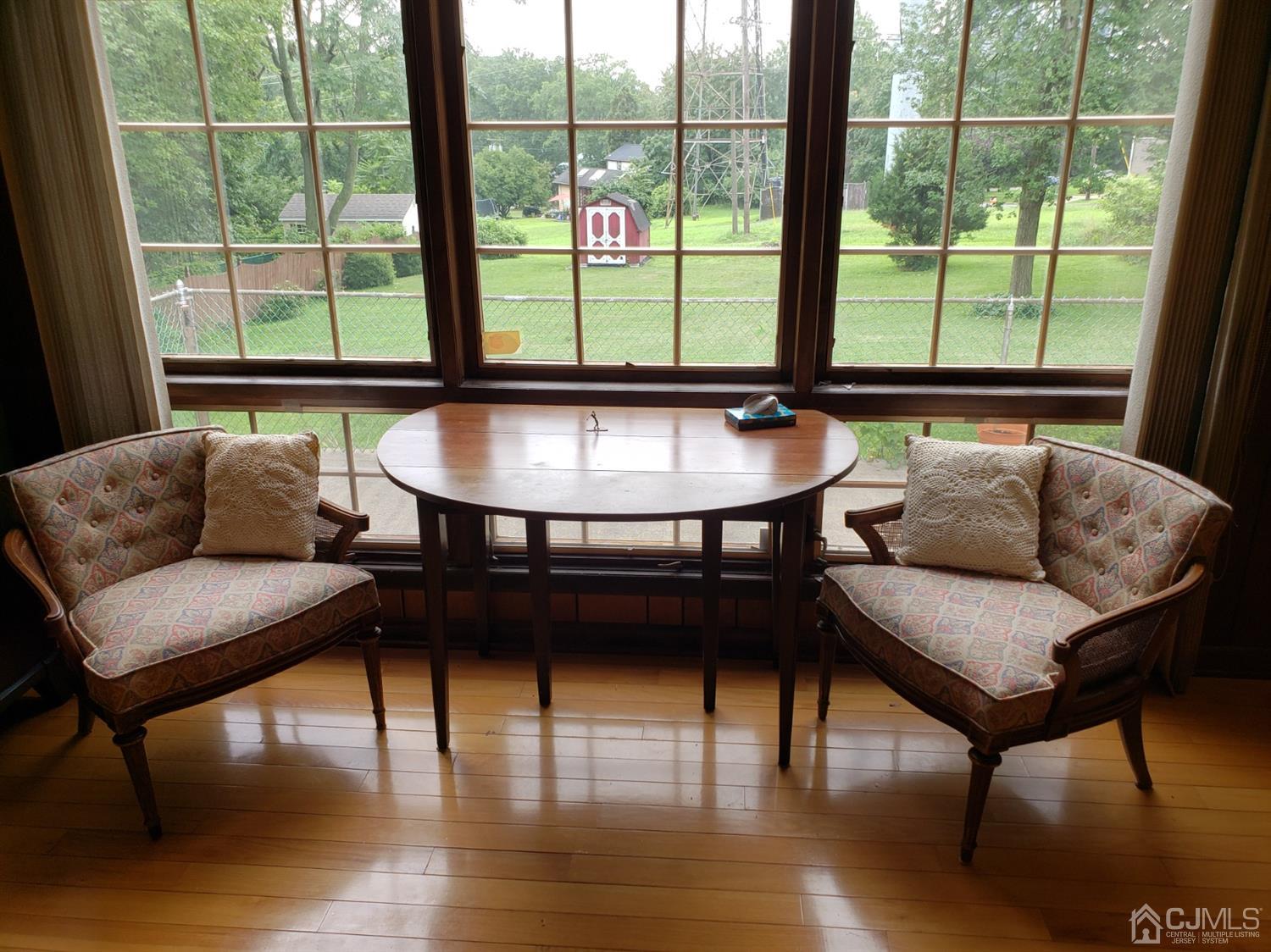 33 Tunison Road New Brunswick, NJ 08901 - Photo 17 of 27 a living room with furniture and a large window