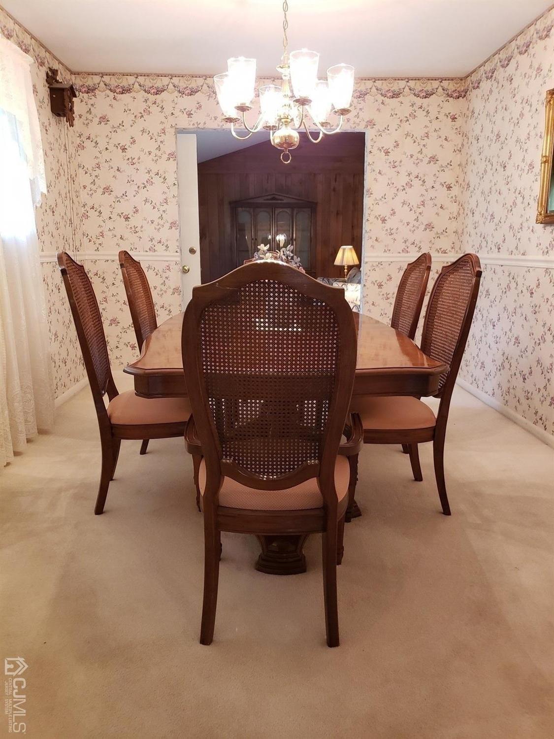 33 Tunison Road New Brunswick, NJ 08901 - Photo 7 of 27 a view of a dining room with furniture and chandelier