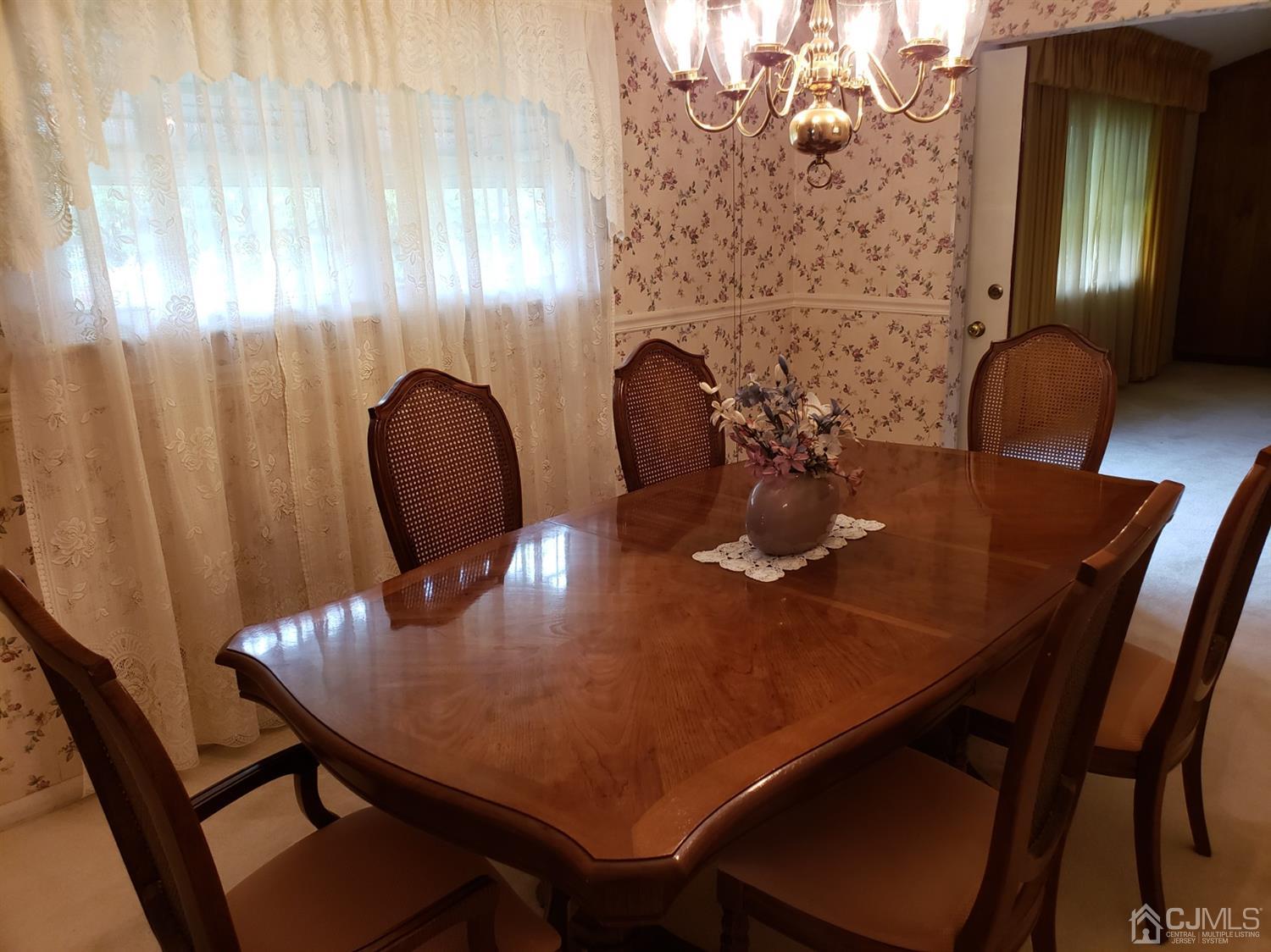33 Tunison Road New Brunswick, NJ 08901 - Photo 8 of 27 a view of a dining room with furniture and wooden floor