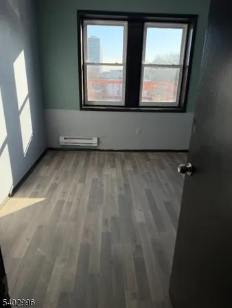 view of room with window and hardwood floor